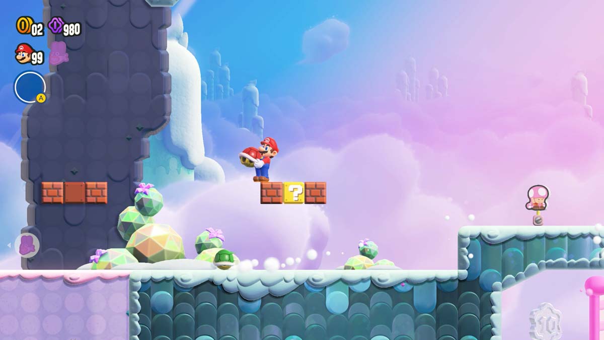 スーパーマリオブラザーズのゲーム内の雪景色の中でハテナブロックを打つマリオ