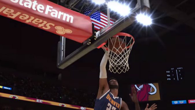 NBA 2k24 で試合中にバスケットボールにダンクをする選手のアクションショット