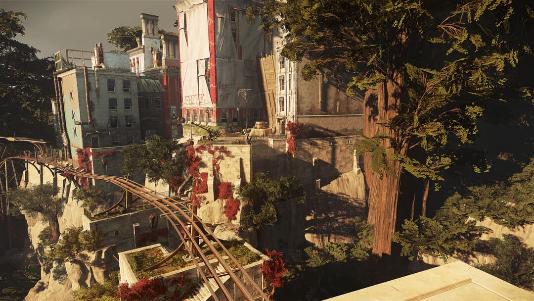 ゲームからのスクリーンショットは、中程度の密度の建物と崖のある町を示す2つの不名誉な2です。