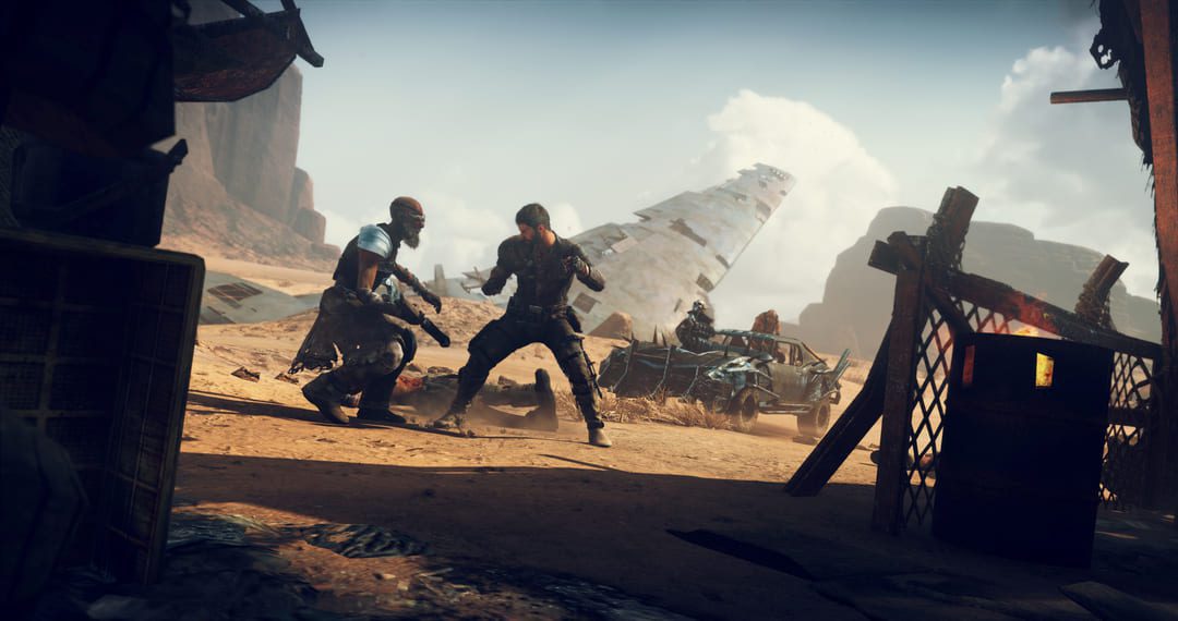 ゲームのスクリーンショットマッドマックスは、砂漠のスクラピードの中で2人のキャラクターの間で白人戦いを示しています