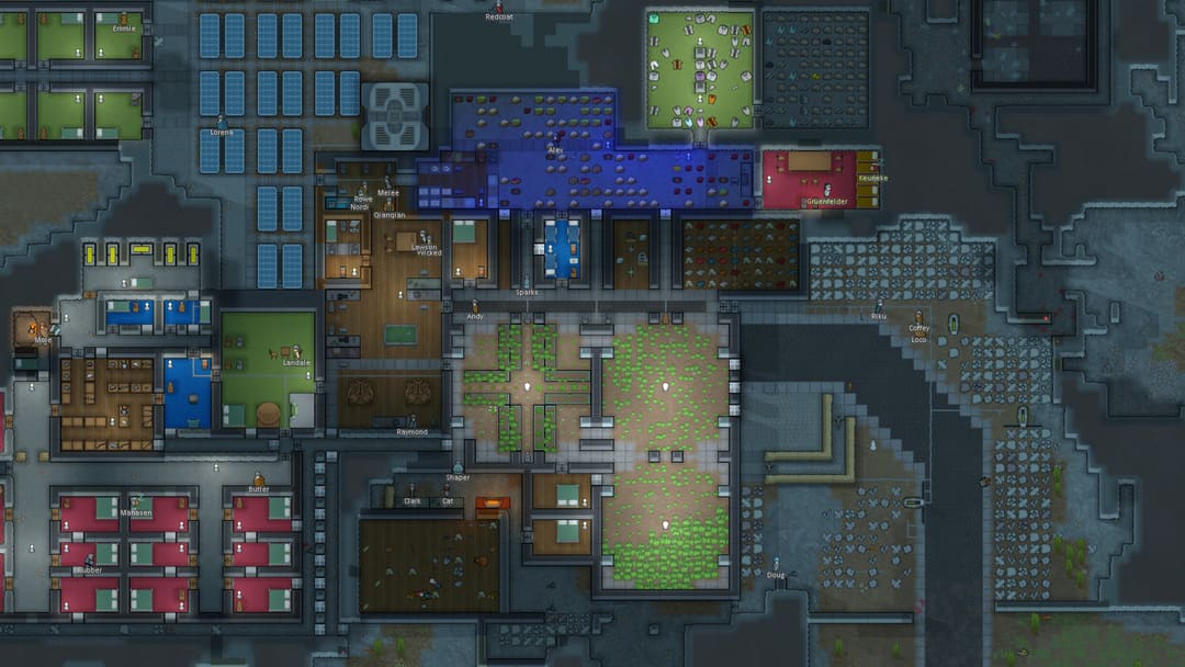 山の側面に組み込まれたコロニーを示すゲームのrimworldのスクリーンショット