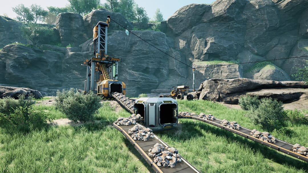 鉱石抽出器と分岐コンベアベルトを示すゲームからのスクリーンショット