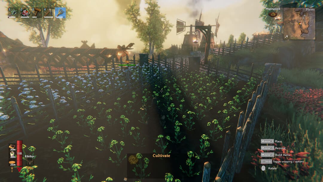 バックグラウンドに風車があるある種の植物の農場を示すゲームのゲームのスクリーンショット