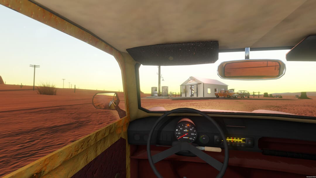 ゲームのスクリーンショットは、砂漠の真ん中にある小さな建物まで運転する車の内部を示すロングドライブをドライブします